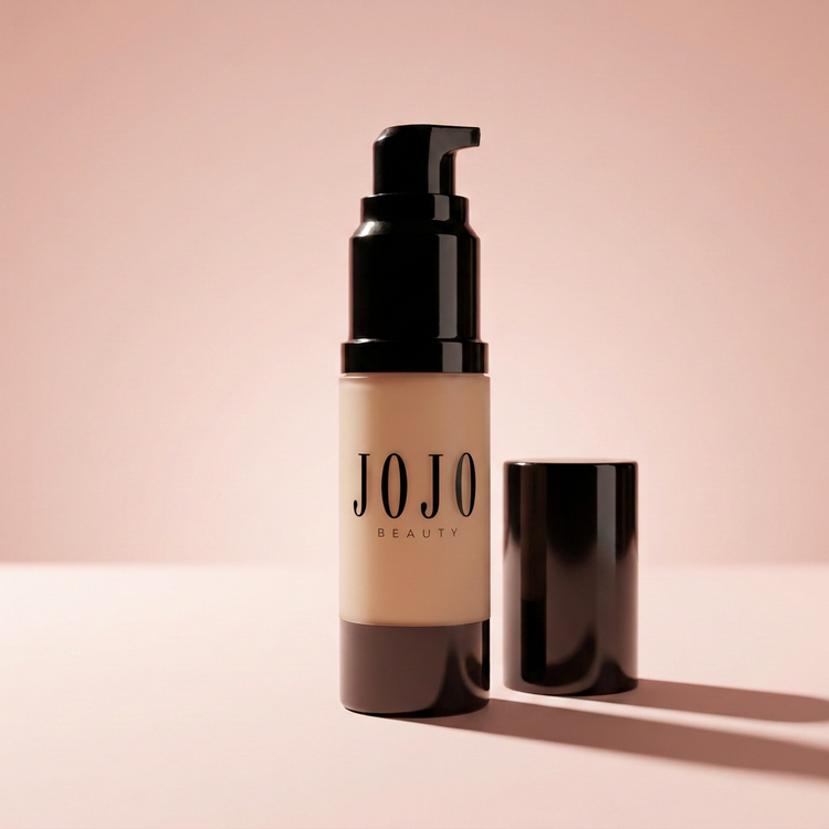 Luminous Liquid Foundation bottle on blush pink